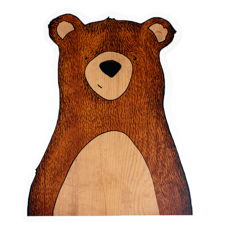 Die-cut sticker of a sweet, smiling little bear with light brown fur, and a subtle woodgrain belly and ears.